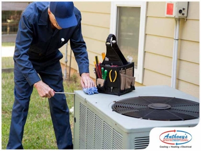 Technician repairing an outdoor equipment