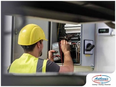 Technician checking electrical box