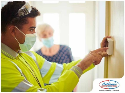 Man adjusting a control