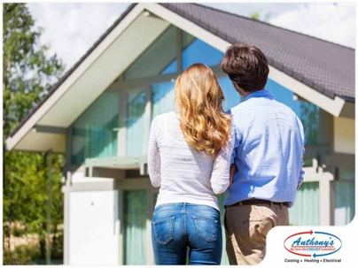 couple admiring a house