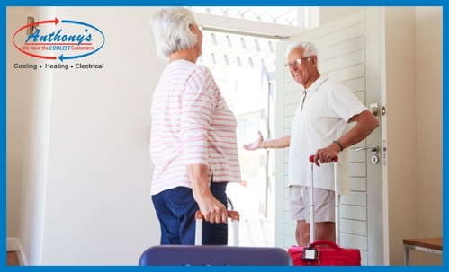 Couple with packed bags leaving for vacation