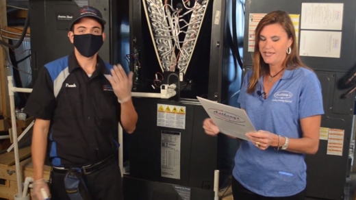 Frank cleaning an Eric system next to Erica.