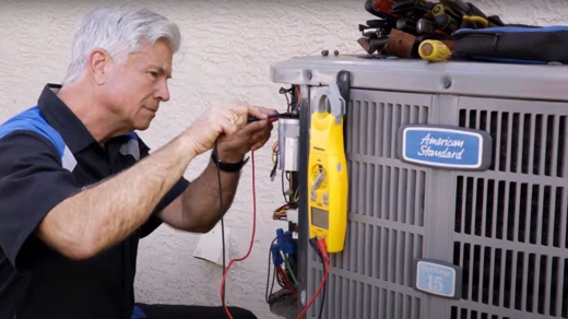 Tech working on American Standard unit