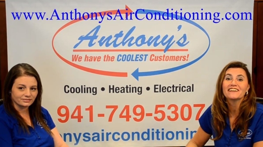 Ladies in front of Anthony's sign