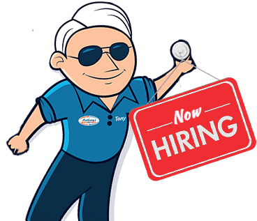Tony holding hiring badge